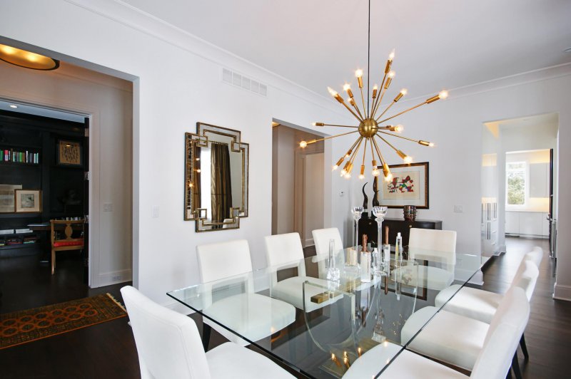 dining room with brass sputnik chadelier