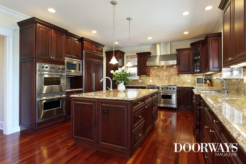kitchen with dark cabinets and hardwood floors