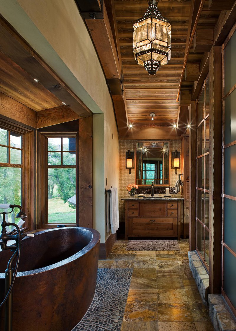 rustic bathroom with metal soaking tub