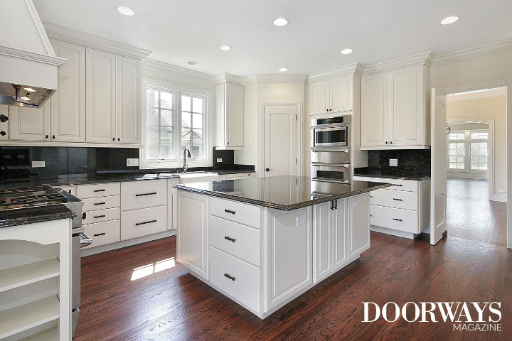 white kitchen cabinets black marble countertops